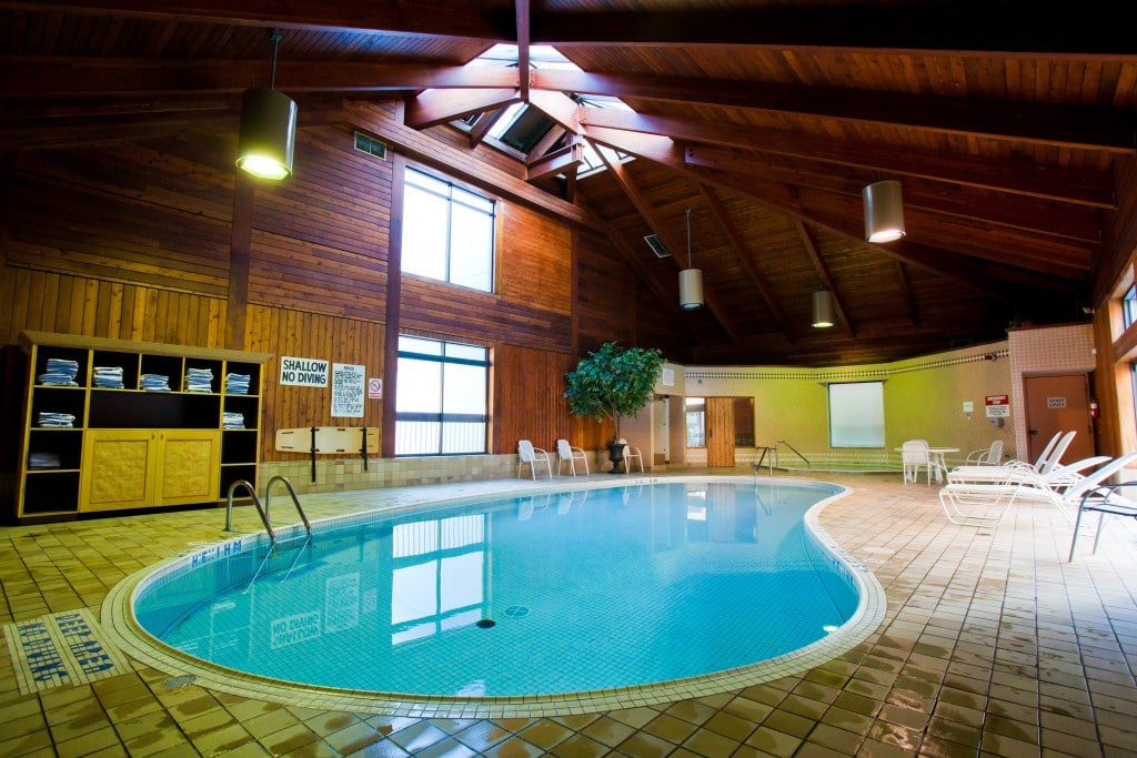 indoor pool with wooden celing